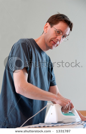 Picture_A_Man_Doing_His_Own_Laundry_and_Ironing_His_Clothes_Helping_Out_with_the_Housework_Pictures_and_Stock_Photos_111021-152902-715001
